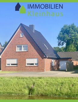 Ansprechendes Einfamilienhaus mit großer gemauerter Partyhütte und Garage an Kanallage zu Kaufen! - Papenburg