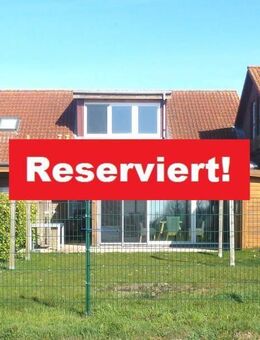 Charmante Doppelhaushälfte im Kettenhausstil mit Wintergarten und Weitblick ins Grüne - Fehmarn