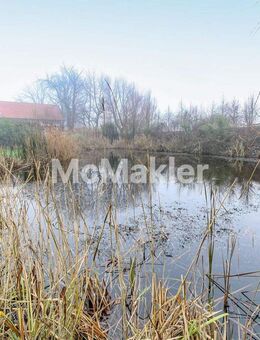 Traumhafte Deichlage für Pferdefreunde: Gehobenes Bauernhaus mit Reithalle, Stallboxen und Hallenbad - Jemgum