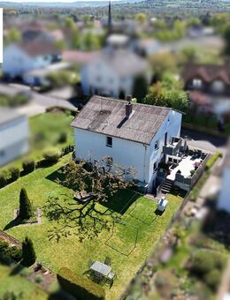 Charmantes Zweifamilienhaus mit traumhaftem Garten & vielseitigem Potenzial in beliebter Wohnlage von Kirchhain - Kirchhain