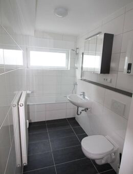 *Bauschheim* Neuwertige 3 Zimmer-Terrassenwohnung im Souterrain mit TGL-Bad - Rüsselsheim