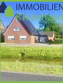 Ansprechendes Einfamilienhaus mit großer gemauerter Partyhütte und Garage an Kanallage zu Kaufen! - Papenburg