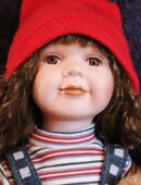 puppe aus Teilporzellan in 25850