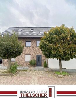 Attraktives Zweifamilienhaus mit angrenzender Doppelhaushälfte, Stellplatz und zwei Garagen - Geilenkirchen