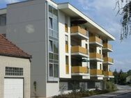 Hohe Wohnqualität: barrierefreie 3-Zimmer-Eigentumswohnung direkt an der Else mit Balkon und Tiefgaragenplatz - Bünde