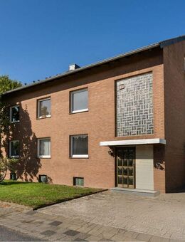 Mehrfamilienhaus mit großem Garten, Garage und Gewerbeeinheit - Rommerskirchen