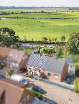 Wasserblick! Modernisierte Doppelhaushälfte mit Traumgarten und Steganlage in Twixlum - Emden