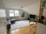 Geschmackvolle Dachgeschosswohnung mit drei Räumen und Einbauküche in Bad Bellingen - Bad Bellingen