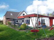 Einfamilienhaus mit Erweiterungsanbau und Garage in Neufeld (Kattrepel) - Neufeld