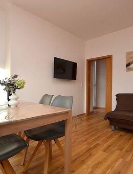 Möblierte 2-Zimmerwohnung mit Wintergarten und Balkon in Greußenheim - Greußenheim
