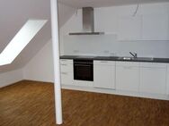 Schicke 2 Zimmer-DG-Wohnung (Erstbezug) mit moderner EBK sowie Südloggia in zentraler Lage - Neckarwestheim