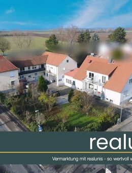 Attraktives Anlageobjekt: 2 Wohnhäuser + Entwicklungsgrundstück - nur bei realunis - Bürstadt