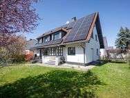 AIGNER - Einfamilienhaus mit Einliegerwohnung: Ihre Ruheoase mit großem Garten im Norden Münchens - München