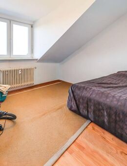 Helle 1-Zimmer-Dachgeschosswohnung mit Einbauküche und solider Rendite in Rheinstetten! - Rheinstetten