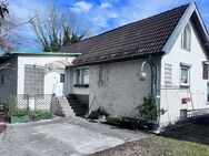 AIGNER - Ruheoase in Lochhausen: Einfamilienhaus mit Potential auf großzügigem Grundstück - München