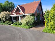 Einfamilienhaus mit Garage und Vollkeller sowie mit naturnahem Garten - Twist