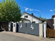 Designwohnen: Modernes Familienhaus mit offenem Raumkonzept und stilvollem Garten - Löhne