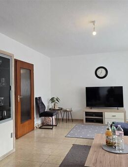 Lichtdurchflutete 3,5-Zimmer-Wohnung mit Balkon, 2 Stellplätzen und Gartenanteil - Wörth (Rhein)