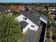 Designwohnen: Modernes Familienhaus mit offenem Raumkonzept und stilvollem Garten - Löhne