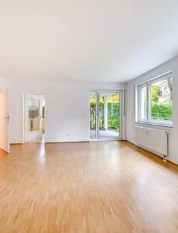 AIGNER - Attraktive 3-Zimmer-Erdgeschosswohnung mit eigenem Garten in direkter Lage am Kolumbusplatz - München