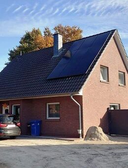 Freistehendes Einfamilienhaus mit Wintergarten, Doppelgarage & Photovoltaik in familienfreundlicher Lage - Wiefelstede