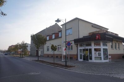 Vielseitiges Immobilienensemble im Herzen der Stadt – Verkauf einer Apotheke mit Wohnung und Einfamilienhaus
