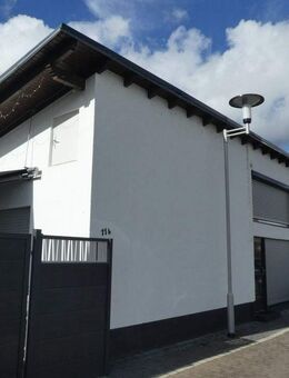 Kernsanierte Erdgeschosswohnung mit Hauscharakter in ruhiger Lage! - Münster (Hessen)