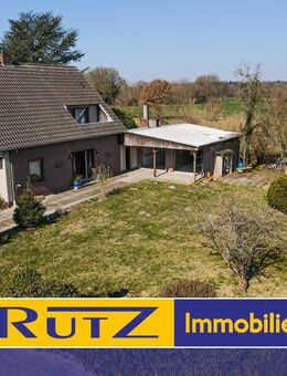 Ganderkesee-Falkenburg | Einfamilienhaus mit Garagenanbau und Vollkeller - Ganderkesee