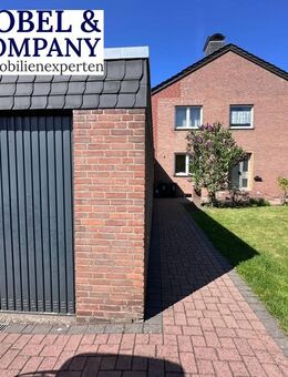 Einfamilienhaus mit Einliegerwohnung, großer Garage und Garten - Hünxe