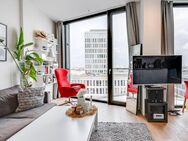 AIGNER - Modernes Wohnen im FRIENDS Tower: 1,5-Zimmer-Apartment mit einzigartigem Ausblick - München