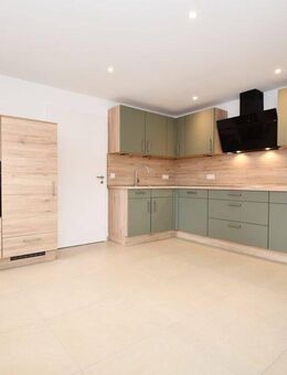 Wohnen mit Wohlfühlcharakter - Mietwohnung mit Balkon, Einbauküche und E-Ladestation in Altenoythe - Friesoythe