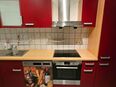 Küche Rot mit Elektrogeräten in 56220