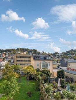 Idar-Oberstein: Großzügiges Reihenmittelhaus mit vermieteter Wohnung und großem Garten - Idar-Oberstein