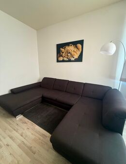 Großes Ecksofa mit Schlaffunktion grau - Osnabrück