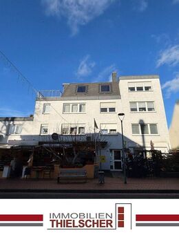 Attraktive Eigentumswohnung mit Dachterrasse und Garage in gepflegtem Wohn- und Geschäftshaus - Übach-Palenberg