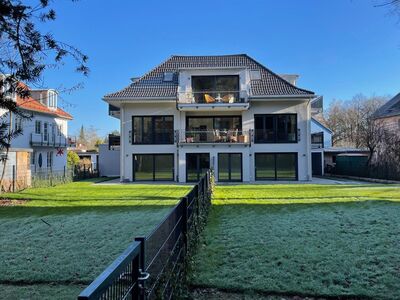 Wunderschöne Gartenwohnung in eleganter Dreifamilienvilla.