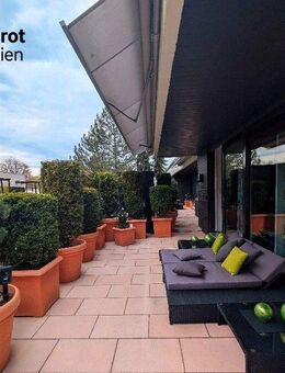 Außergewöhnliche Dachterrassenwohnung mit zusätzlichem Wintergarten in Solln - München