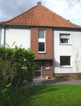 DHH mit 3 Wohnungen, 4 Garagen und zusätzlichem Bauplatz in attraktiver Innenstadtlage - Rheda-Wiedenbrück