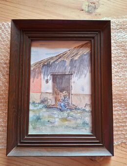 7 - Mann sitzt vor Hütte - Wolfsburg