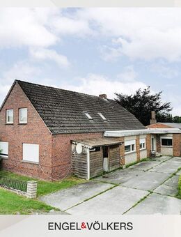 Idyllische Kanallage: Mehrparteienhaus mit großem Grundstück - Wiesmoor