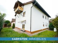 Attraktives Mehrfamilienhaus kaufen: 3 Wohnungen, Garten & Garagen in 84518 Garching a.d. Alz - Garching (Alz)