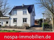 Teilunterkellertes, einseitig angebautes Einfamilienhaus mit Gartenteich und Carport! - Borgstedt