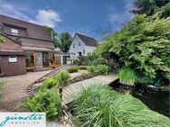 Holzwickede: Schönes, freistehendes Ein-/Zweifamilienhaus mit großem Garten, Gartenteich und Garagen - Holzwickede