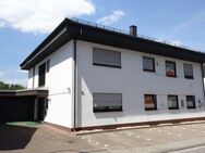 Gepflegtes 1-2-Familienhaus mit Praxis und Doppelgarage in Zentrumslage von 66981 Münchweiler - Münchweiler (Rodalb)