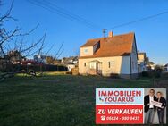 Freistehendes Einfamilienhaus mit großem Garten, Baugrundstück und Garage in guter Lage in Ottweiler - Ottweiler