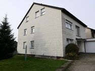 Mehrfamilienhaus in Bielefeld mit drei Massivgaragen und Garten - Bielefeld