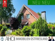 Mit Blick auf die Pferdeweide: Gepflegtes Einfamilienhaus mit Garage und sichtgeschütztem Garten - Krummhörn