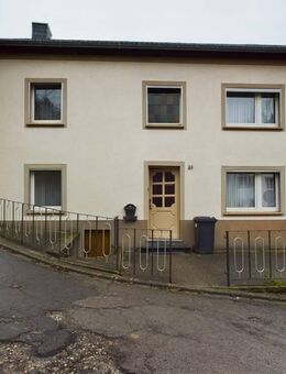 Familienhaus mit großem Inneren und kleinem Garten in ruhiger Lage. - Bettingen