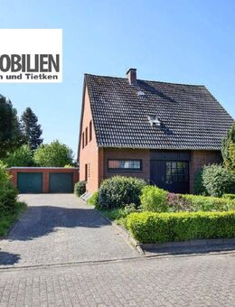TT bietet an: Landleben mit Perspektive: Vermietetes Zweifamilienhaus mit großem Garten in idyllischer Lage von Zetel-Neuenburg! - Zetel