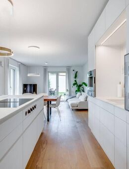 AIGNER - Exklusiv ausgestattete Erdgeschosswohnung mit 4 Zimmern und über 220 m² Garten - München